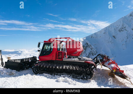 snowcat on a snowy slope in a ski resort Stock Photo