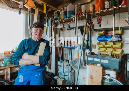 Portrait of a senior man in his wood workshop. Stock Photo