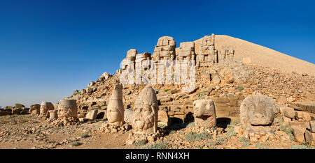 Statue heads, from right,  Lion, Eagle, Herekles, Apollo, Zeus, Commagene, Antiochus, & Eagle, with headless seated statues in front of the stone pyra Stock Photo