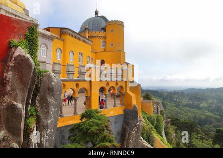 SINTRA, PORTUGAL - MAY 21, 2018: Tourists visit Pena Palace in Sintra. Portugal had 12.7 million foreign visitors in 2017. Stock Photo