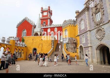 SINTRA, PORTUGAL - MAY 21, 2018: Tourists visit Pena Palace in Sintra. Portugal had 12.7 million foreign visitors in 2017. Stock Photo