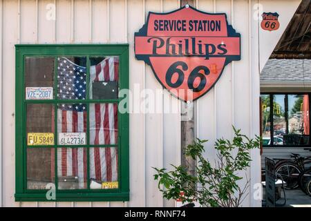 Window with American flag at historic gas station Shea's Gas Station, Museum on Route 66, Springfield, Illinois, USA Stock Photo