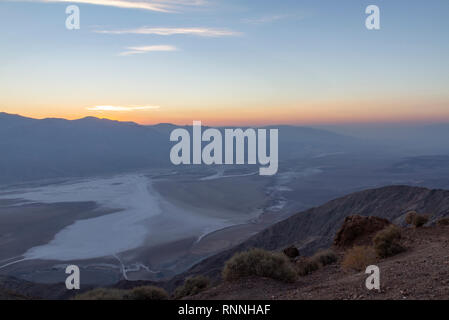 Sunset viewed over Death Valley (Badwater) towards the Panamint Range.  View from Dante's View, Death Valley National Park, California, United States. Stock Photo