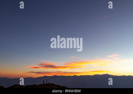 Sunset viewed over Death Valley (Badwater) towards the Panamint Range.  View from Dante's View, Death Valley National Park, California, United States. Stock Photo