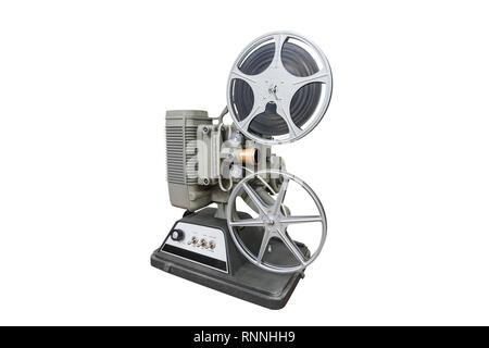 man set up film reel on vintage 8mm movie projector in dark room