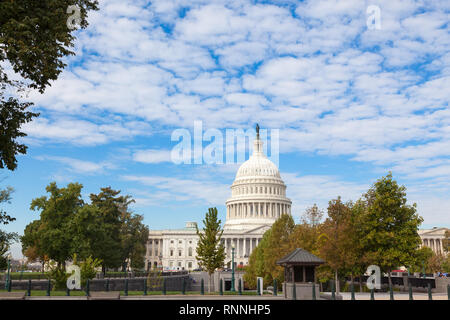 Washington DC, USA -  17 OCTOBER, 2013: Capitol USA Building at day. People tourists on background of east front at day. White feather clouds and blue Stock Photo