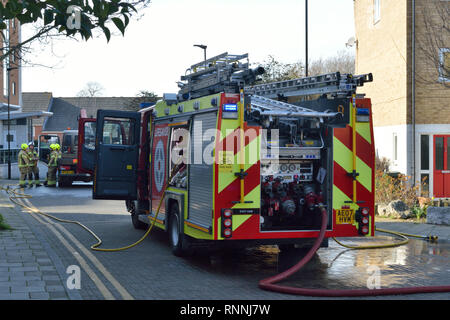 Firefighters tackling a lorry fire on a residential street Stock Photo