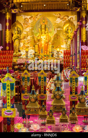 Singapore Buddha Tooth Relic Temple.  Buddha Maitreya Flanked by Two Bodhisattvas in Main Prayer Hall. Stock Photo