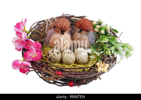 Easter handmade  nest from birch twigs  with funny birds  and eggs. Isolated on white studio macro shot Stock Photo