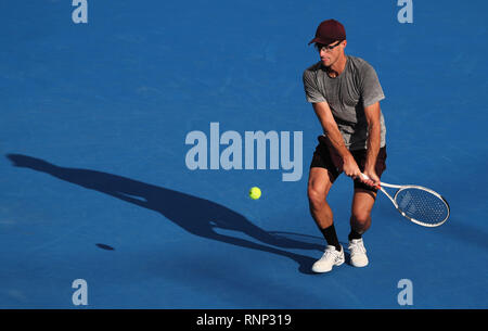 Delray Beach, Florida, USA. 19th Feb, 2019. Peter Polansky, of Canada, returns the ball to John Isner, of the United States, during the first round of the 2019 Delray Beach Open ATP professional tennis tournament, played at the Delray Beach Stadium & Tennis Center in Delray Beach, Florida, USA. Mario Houben/CSM/Alamy Live News Stock Photo