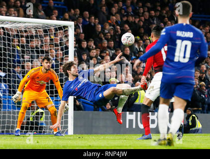 Beijing, China. 18th Feb, 2019. Chelsea's Marcos Alonso (2nd L) makes a bicycle kick during the FA Cup fifth round match between Chelsea and Manchester United in London, Britain on Feb. 18, 2019. Manchester United won 2-0. Credit: Han Yan/Xinhua/Alamy Live News Stock Photo