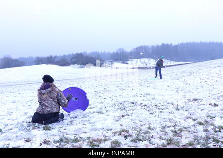 Two teenagers having a snowball fight Stock Photo