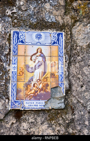 Ancient ceramic tile on a portuguese wall Stock Photo