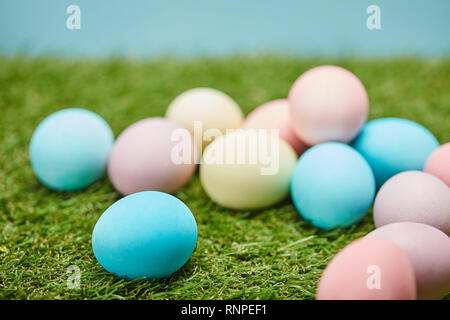 selective focus of easter painted eggs on grass Stock Photo