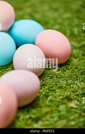 selective focus of painted easter eggs on grass Stock Photo