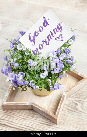 Good Morning postcard on white marble table Stock Photo