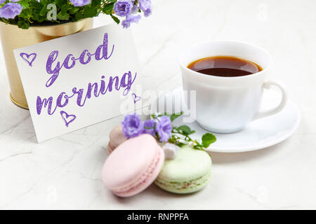 Good Morning postcard on white marble table Stock Photo