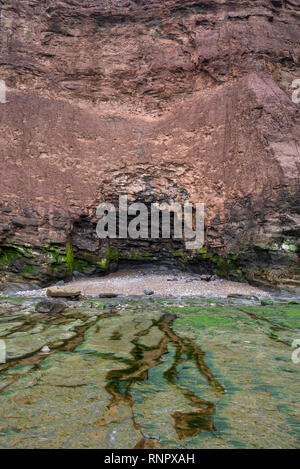 Rocky cliff at Huntcliff, Saltburn-by-the-sea, North Yorkshire, England. An area of interesting geology. Stock Photo