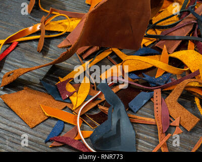 Pieces of colorful leather on a wooden background Stock Photo