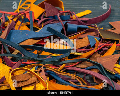 Pieces of colorful leather on a wooden background Stock Photo