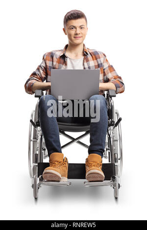 Smiling young guy in a wheelchair with a laptop isolated on white background Stock Photo