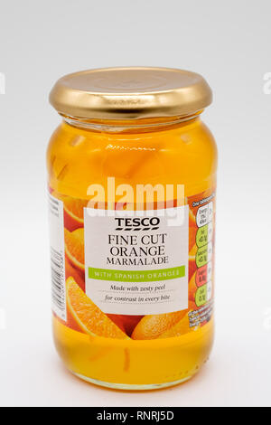 Largs, Scotland, UK - February 19, 2019: Tesco Branded Fine Cut Marmalade with Recyclable Glass Container and top. Stock Photo