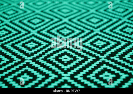 Closed up beautiful mint green and black colored ethnic pattern fabric Stock Photo