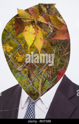 Fence and vines cut-out portrait of a man in a business suit Stock Photo