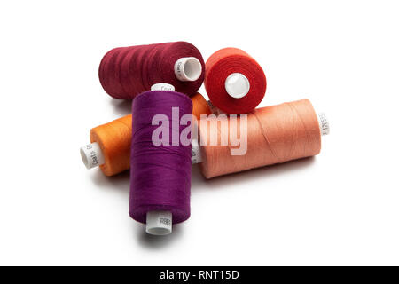 Set of color spool  sewing threads on isolated white background Stock Photo