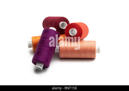 Set of color spool  sewing threads on isolated white background Stock Photo