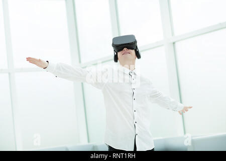 young men testing virtual reality glasses in office Stock Photo