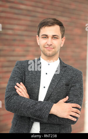 Executive businessman on the background of the office Stock Photo
