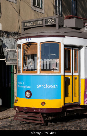 Traditional old tram no.28 on Rua São Tomé, Alfama, Lisbon, Portugal Stock Photo