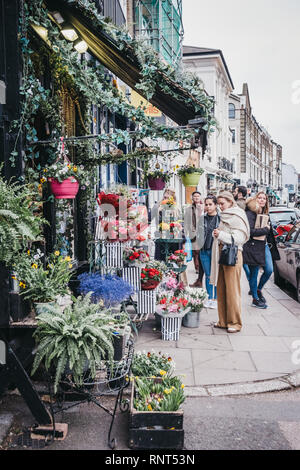 London, UK - February 16, 2019: People by the The Fitzroy's Flowers Collection florist in Primrose Hill, an upscale area of North London that got its  Stock Photo