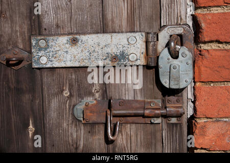 Padlocked door with bolt. Secure Stock Photo