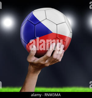 Man holding Soccer ball with flag Stock Photo