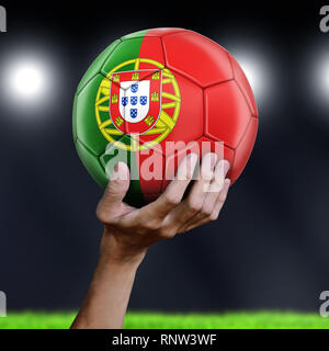 Man holding Soccer ball with flag Stock Photo