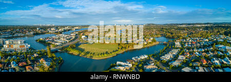 Aerial panorama of Varsity Lakes suburb, Reedy Creek and Lake Orr at sunset. Gold Coast, Queensland, Australia Stock Photo
