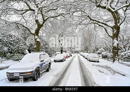 Snow covered street in winter,  East Vancouver, British Columbia, Canada Stock Photo