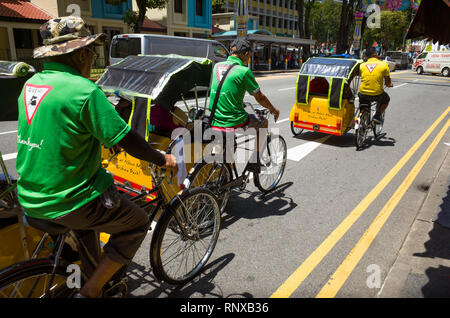 Rickshaw bicycle riding tours on Serangoon Street during Deepavali Festival.