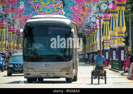 Deepavali Traffic and Decorations, With Older Man Riding Tricycle -  Little India, Singapore Stock Photo