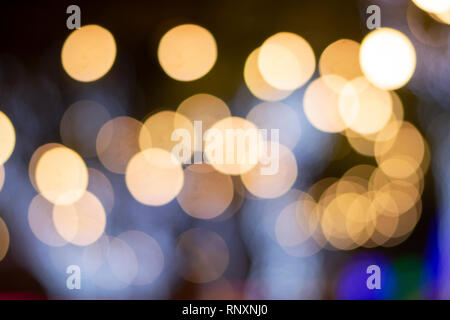 night city street lights bokeh background,lights blurred bokeh background for your design vintage or retro color Stock Photo