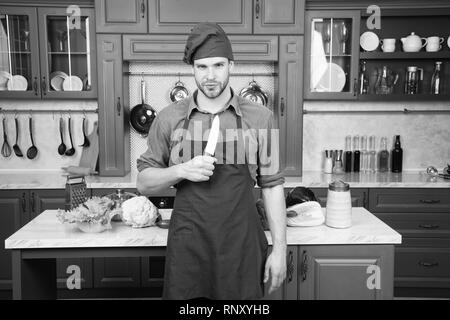 Man wear apron cooking in kitchen. Man use sharp cleaver knife. Types of  knives. Sharp knife professional tool. Chef choose professional tools. Chef  hold cleaver knife tool ready to chop ingredients Stock