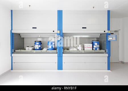 Vertical carousel storage shelves in warehouse Stock Photo