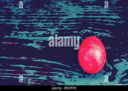 Colorful easter egg on blue pastel color wood background with copy space. the view from the top. glare, glitter, copy space, copyspace Stock Photo