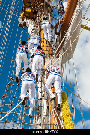 Crew climbing the rigging of Mexican navy training ship, Cuauhtemoc. Stock Photo