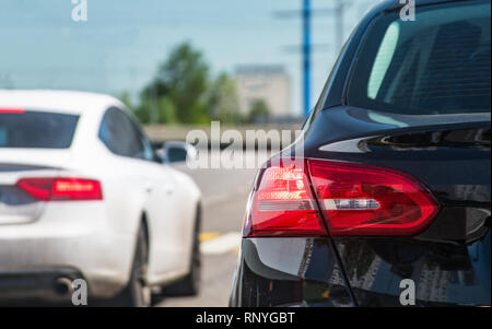 Traffic on road, rear car view displaying stop ligths Stock Photo