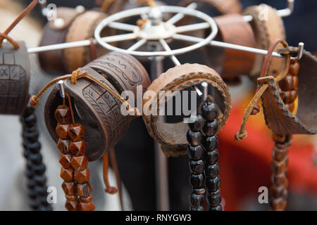 Many various leather and textile bracelets at the street market. Stock Photo