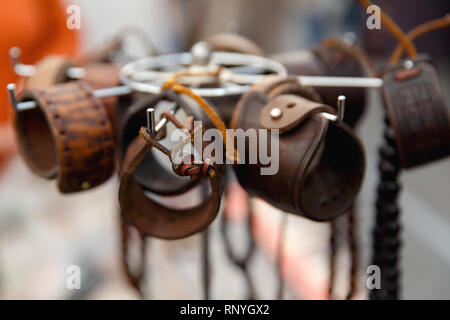 Leather handmade souvenir bracelets at the street market - shopping background Stock Photo