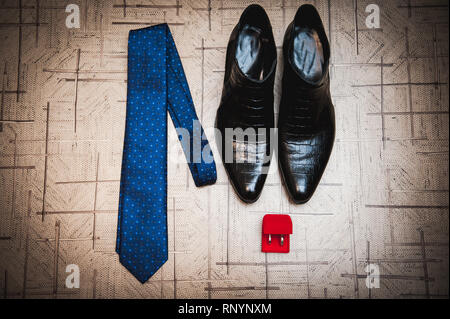 Groom accessories. Shoes, tie, rings in a wedding day. Stock Photo